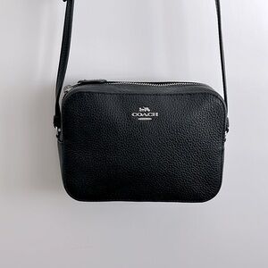 Coach leather camera bag. 5 1/2 x 7 1/2. Silver hardware. Lightly used.